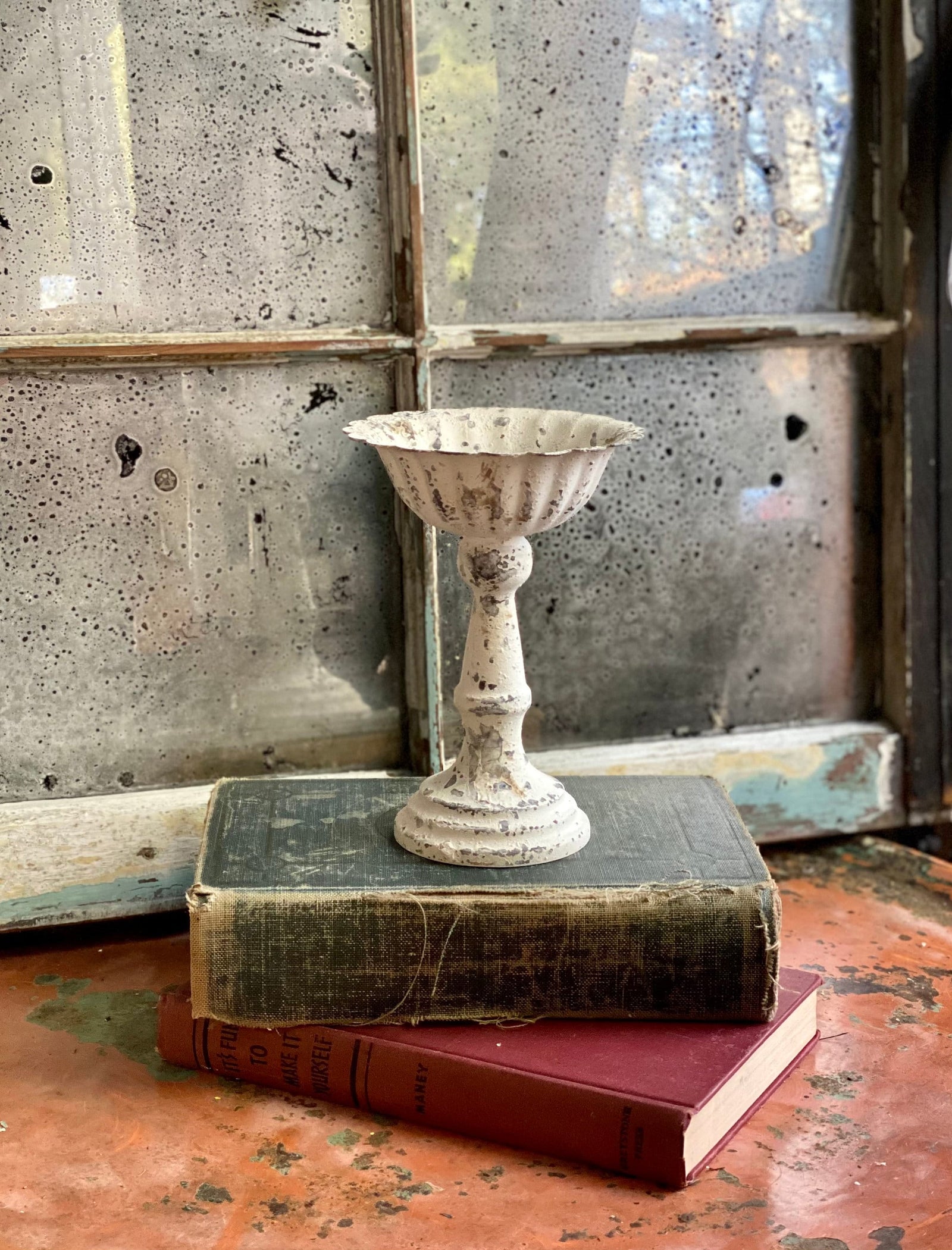 The Tish White Distressed Metal Pedestal Candle Stand