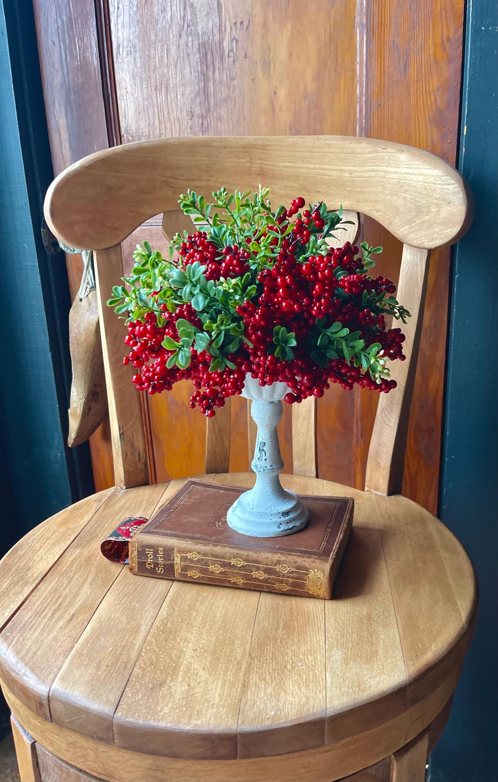 The Evie Red Berry & Boxwood Floral arrangement