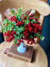 The Evie Red Berry & Boxwood Floral arrangement