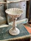 The Tish White Distressed Metal Pedestal Candle Stand